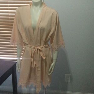 Woman’s robe size is XX small. Peach color. S S Weddings.